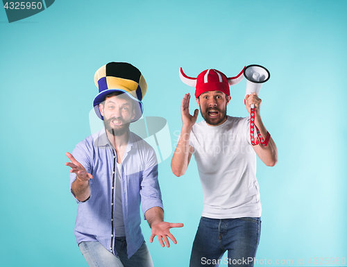 Image of The two football fans over blue
