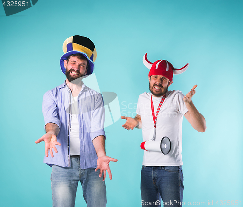 Image of The two football fans over blue