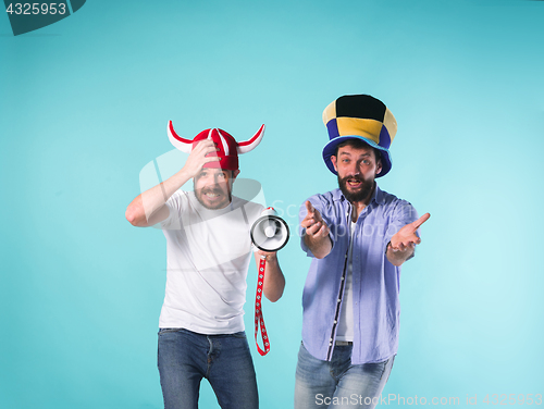 Image of The two football fans over blue