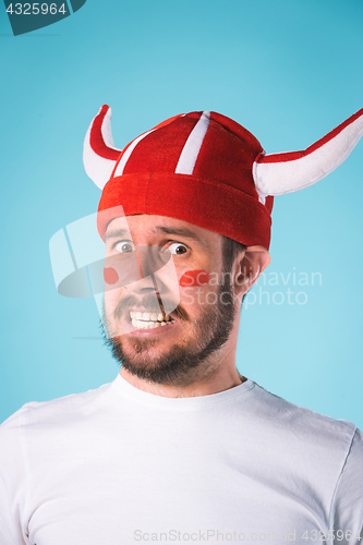 Image of The football fan over blue