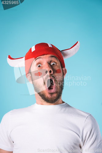 Image of The football fan over blue