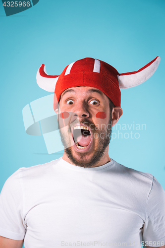 Image of The football fan over blue