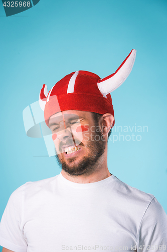 Image of The football fan over blue