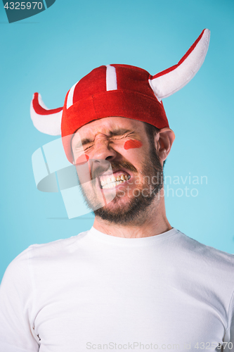 Image of The football fan over blue