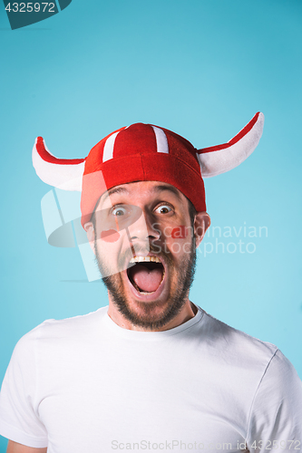 Image of The football fan over blue