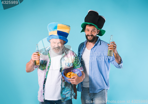 Image of The two football fans over blue