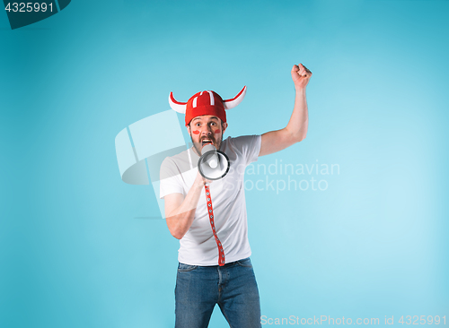 Image of The football fan over blue