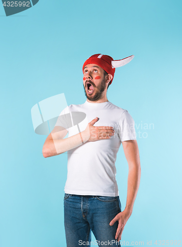 Image of The football fan over blue
