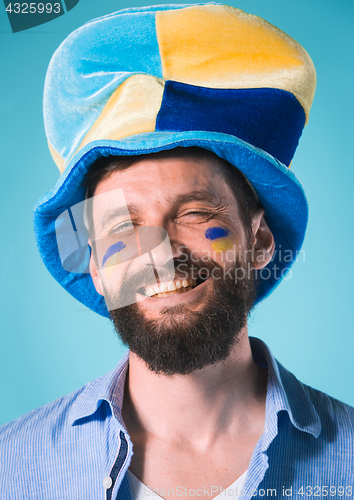 Image of The football fan over blue