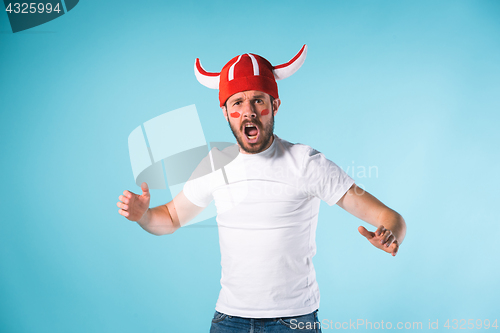 Image of The football fan over blue