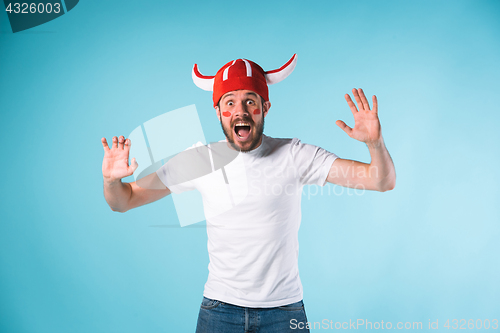 Image of The football fan over blue