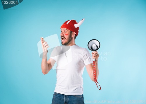 Image of The football fan over blue