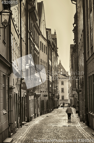 Image of STOCKHOLM, SWEDEN - AUGUST 19, 2016: View of narrow street and c