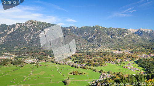 Image of Aerial landscape with green meadow in Alpine valley