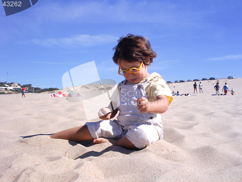 Image of kid playing with sand