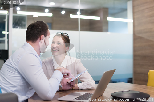 Image of Business People Working With Tablet in startup office