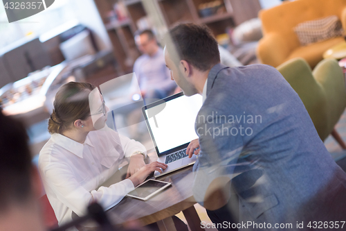 Image of Business team Working With laptop in creative office