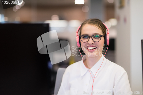 Image of businesswoman using a laptop in startup office