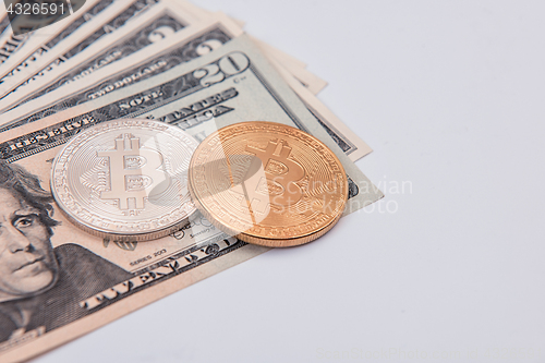 Image of Bitcoin coin with dollars