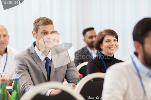 Image of happy business team at international conference