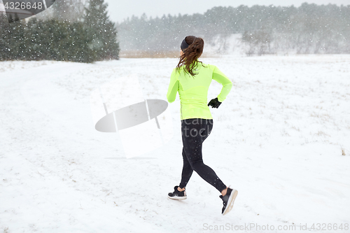 Image of woman running outdoors in winter