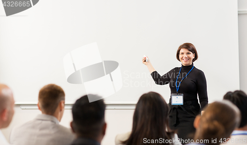 Image of group of people at business conference or lecture