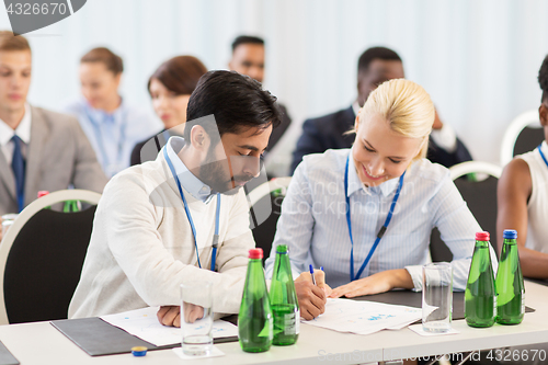 Image of happy business team at international conference