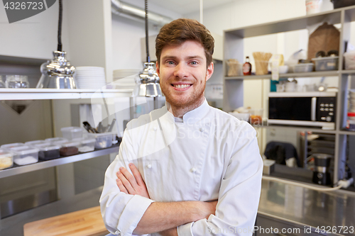 Image of happy male chef cook at restaurant kitchen