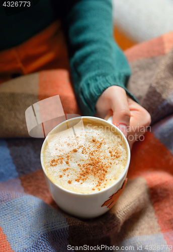 Image of Girl with cup of cappuccino coffee