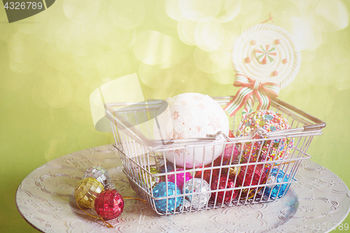 Image of Christmas toys in shopping basket, retro toned