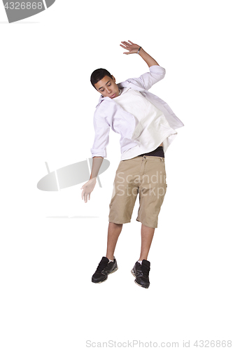 Image of Young boy jumping over white background
