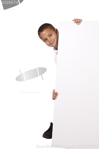 Image of Cute little boy holding a blank sign