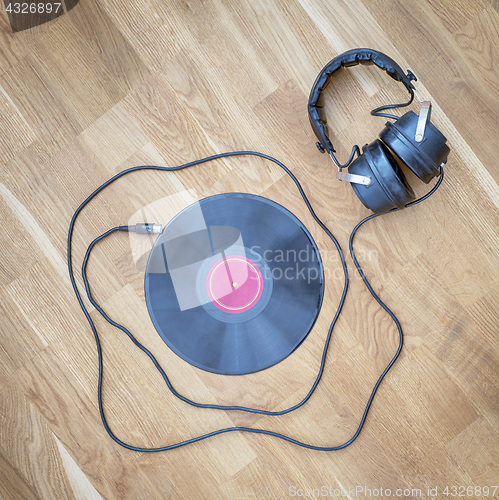 Image of Old vinyl record and headphones