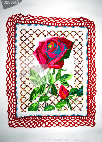 Image of embroidered flower on fabric