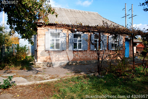 Image of old house in sunny time