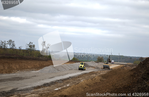 Image of road construction excavator asphalt paver