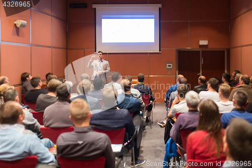 Image of Speaker Giving a Talk at Business Meeting.