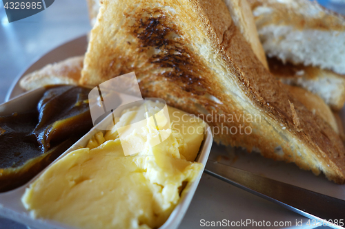 Image of French toast with butter and kaya