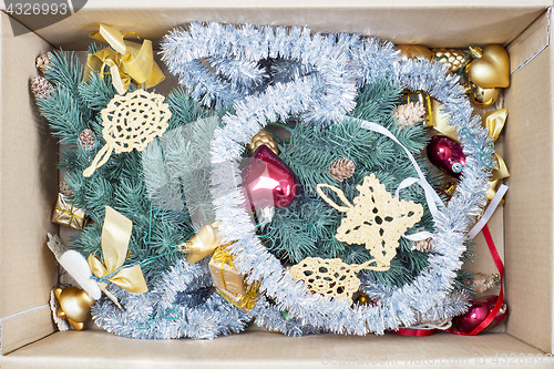 Image of christmas tree, glitter baubles and tinsel in the box