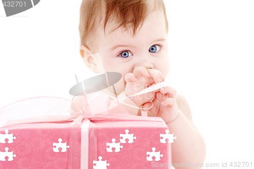 Image of baby boy with puzzle gift box