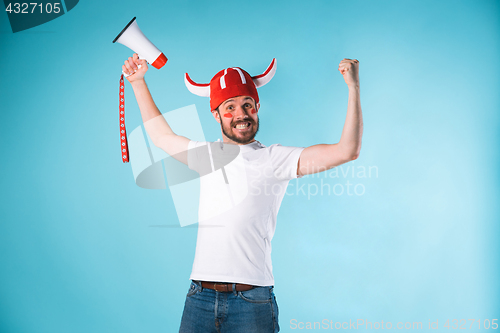 Image of The football fan over blue