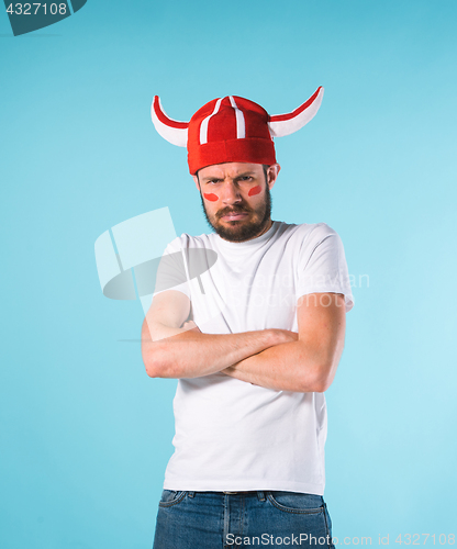 Image of The football fan over blue