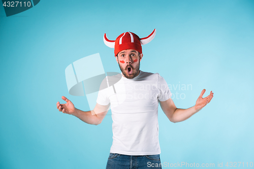 Image of The football fan over blue