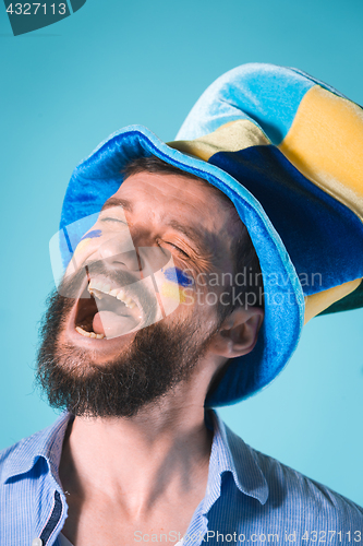 Image of The football fan over blue