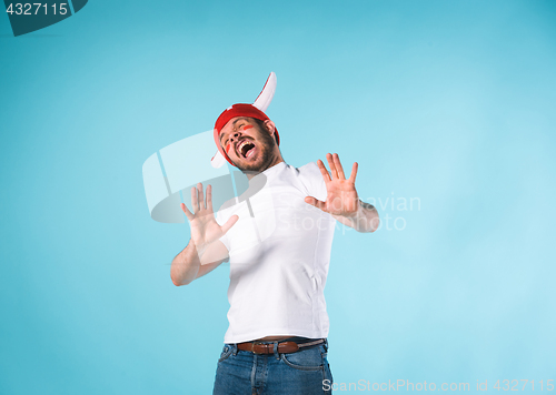 Image of The football fan over blue