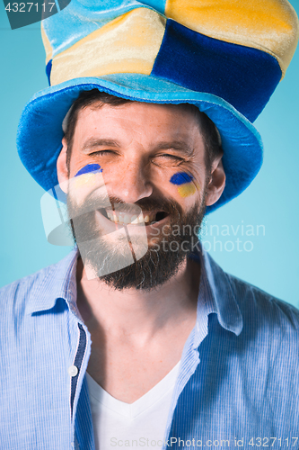 Image of The football fan over blue