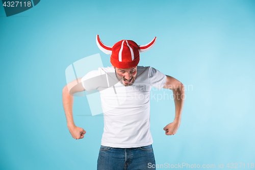 Image of The football fan over blue