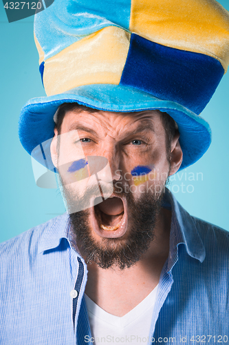 Image of The football fan over blue