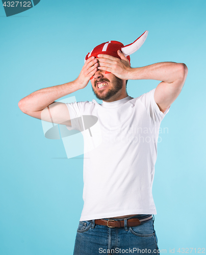 Image of The football fan over blue