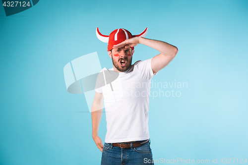 Image of The football fan over blue